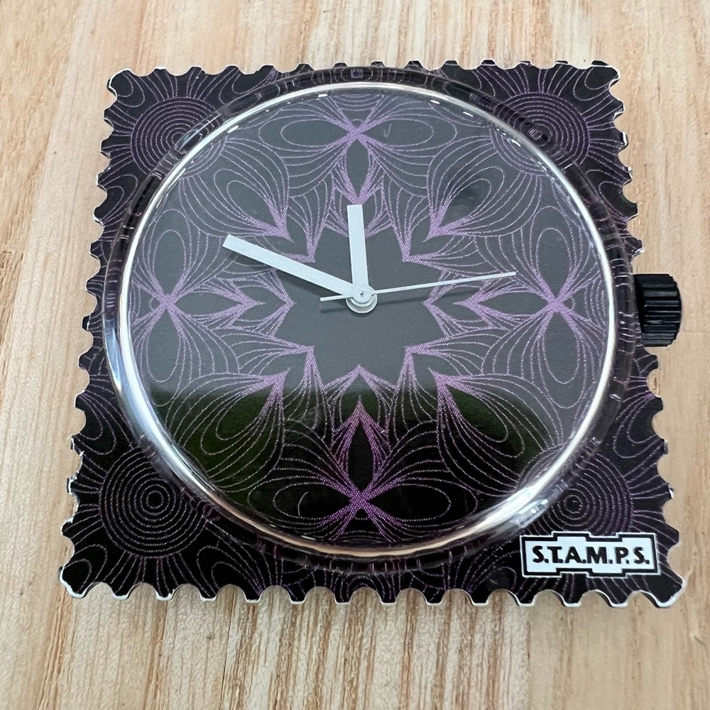 S.T.A.M.P.S. Interchangeable watch face with black and purple design
